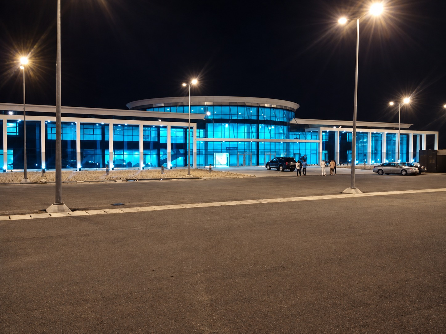 Night view of the airport terminal and approach roads with extensive lighting