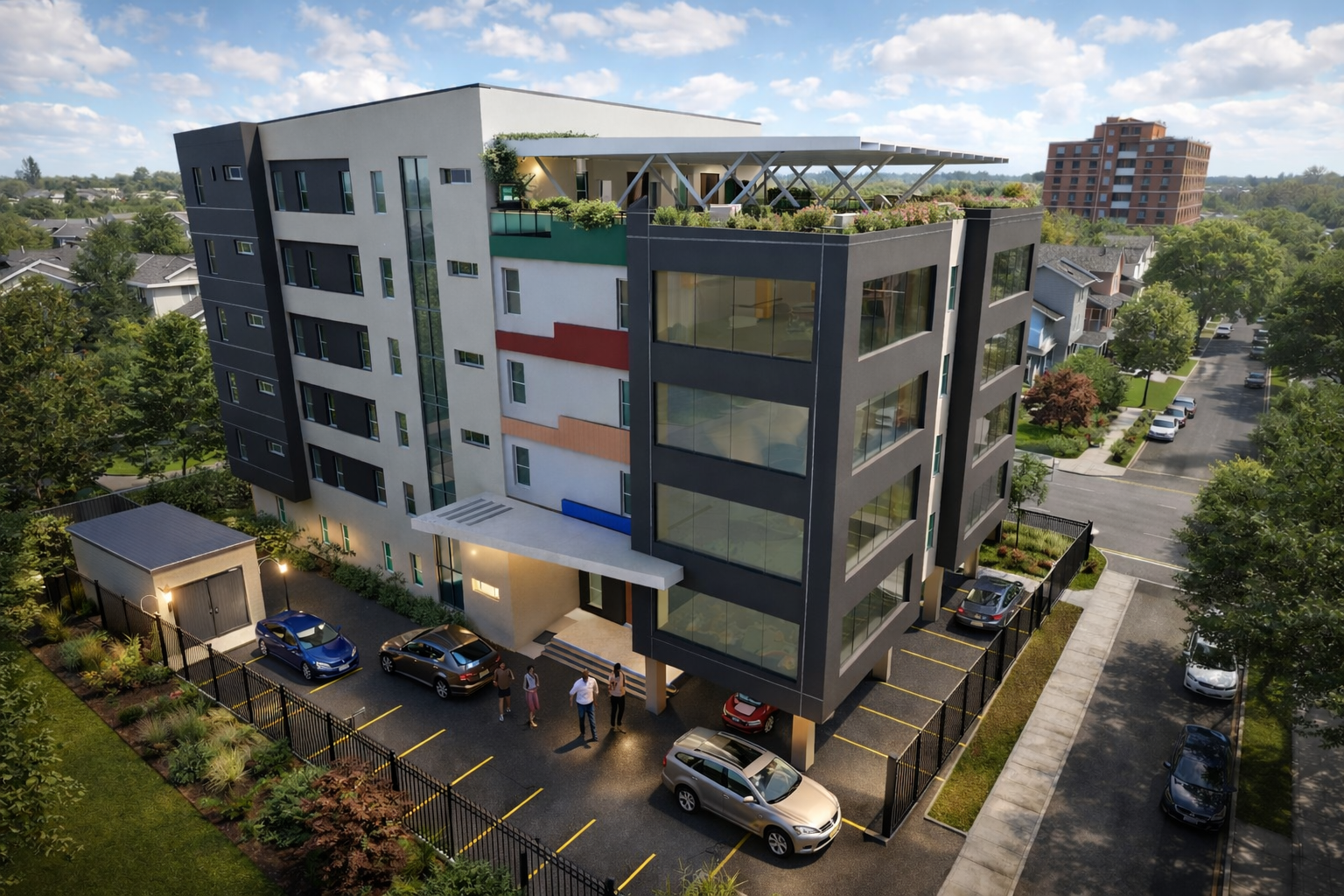 Aerial view of a modern multi-storey commercial building with rooftop planting and landscaped parking
